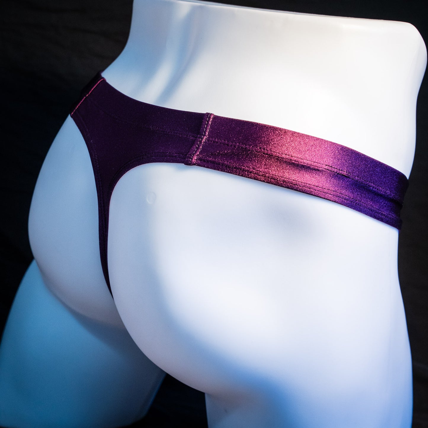 Men's plum purple robust cut thong underwear. rear angled view.