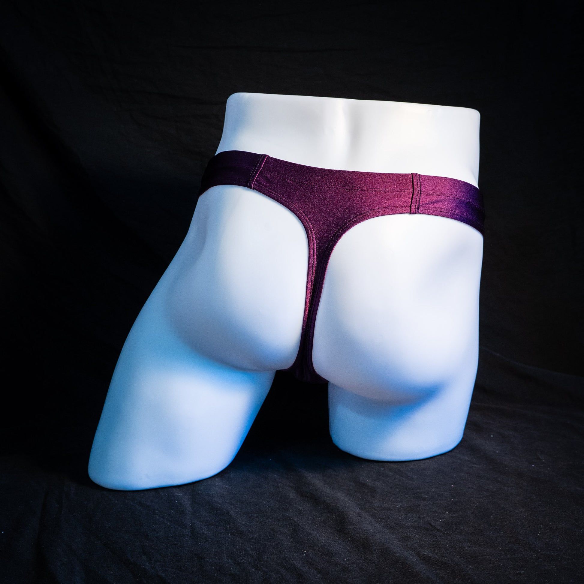 Men's plum purple robust cut thong underwear. full rear view.