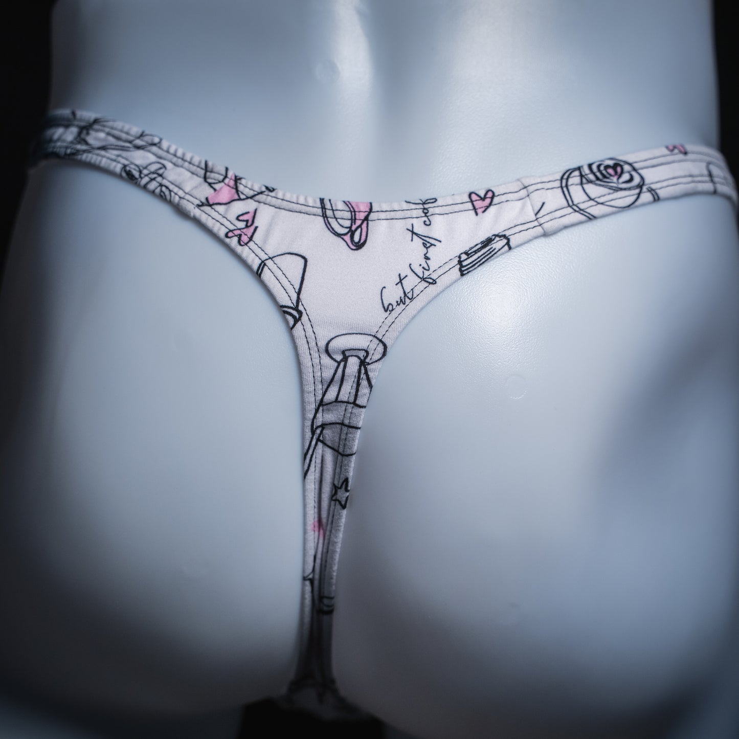 Men's thong with coffee mugs, classic cut, rear view.