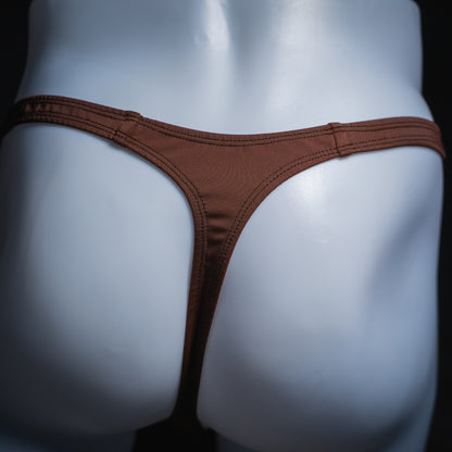 Men's solid brown thong, slim cut, rear view.