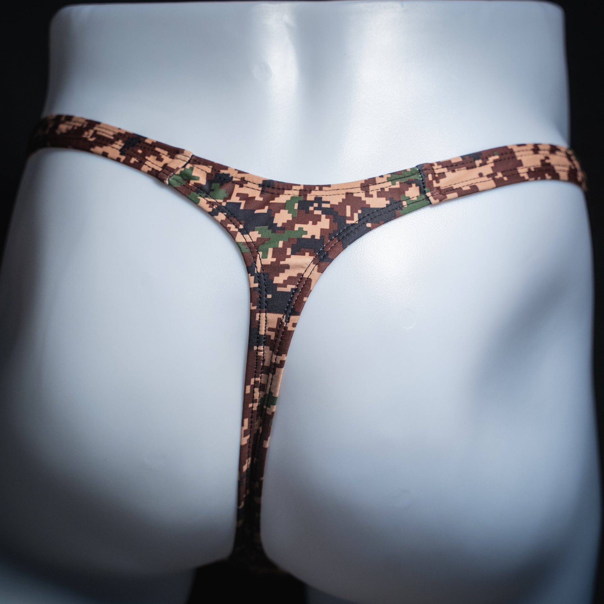 Men's digital camo thong, slim cut, rear view.
