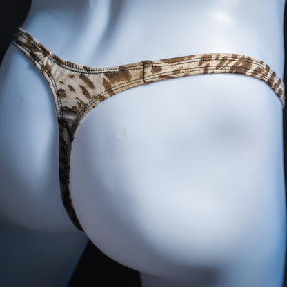 Men's silky leopard thong, slim cut, angled rear view.