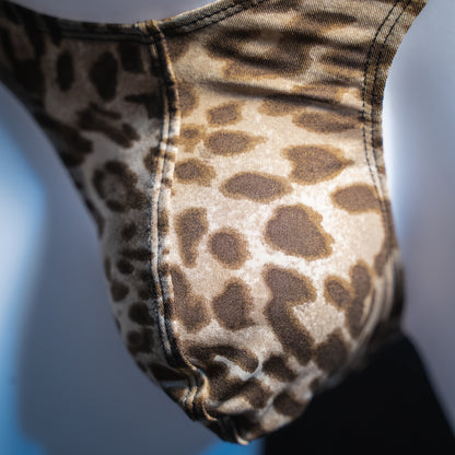 Men's silky leopard thong, slim cut, front closeup view.