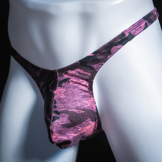 Men's pink camo thong, slim cut, angled front view.