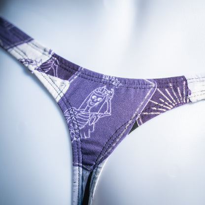 Men's purple tarot card thong, slim cut, closeup rear view.