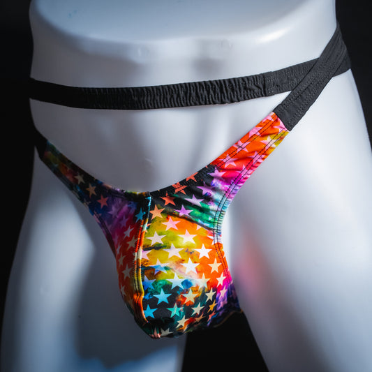Men's double strap thong with star pattern, slim cut, angled front view.