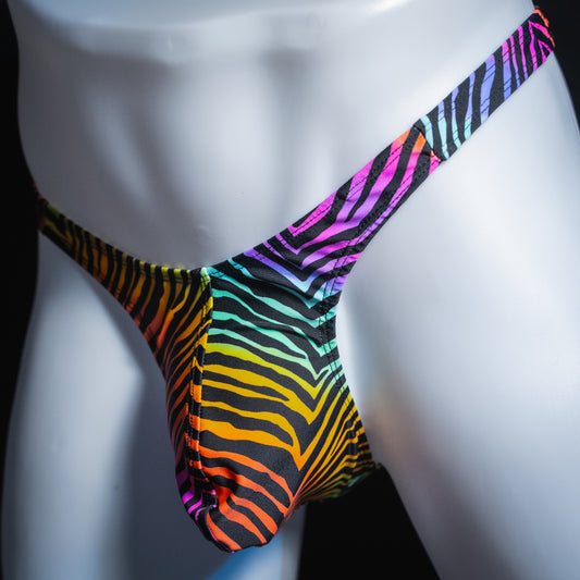 Men's rainbow zebra thong, slim cut, angled front view.