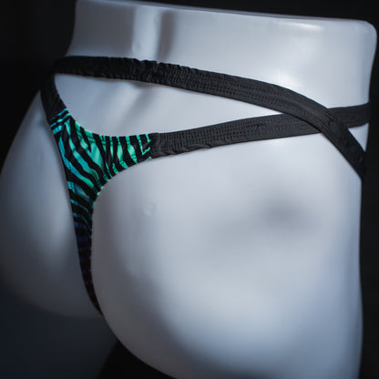 Men's rainbow zebra double strap thong, slim cut, angled rear view.