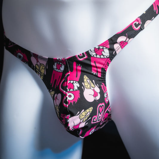 Men's pink monsters on black thong, slim cut, angled front view.