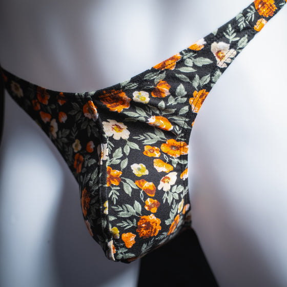 handmade mens thong underwear, classy floral design, soft polyester material, classic cut variation, angled front view