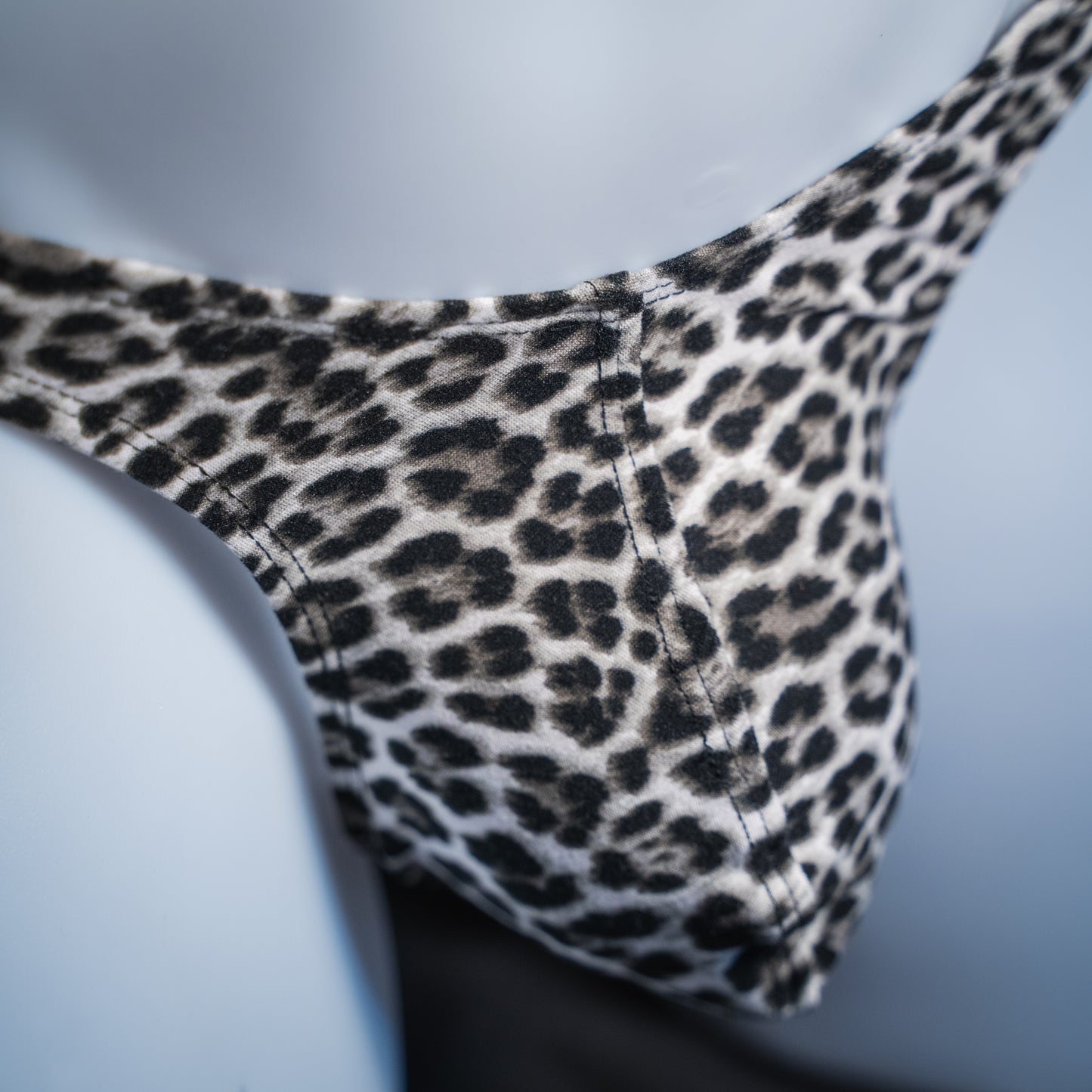 handmade mens thong underwear, snow leopard print, soft polyester, front view, detail close up view