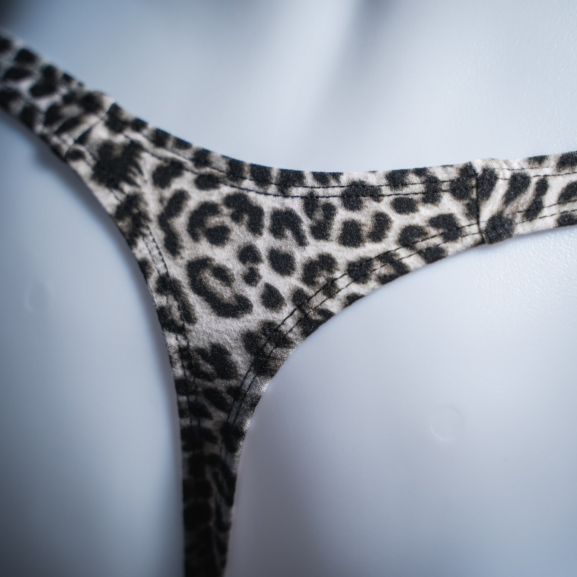 handmade mens thong underwear, snow leopard print, soft polyester, detailed back view close up