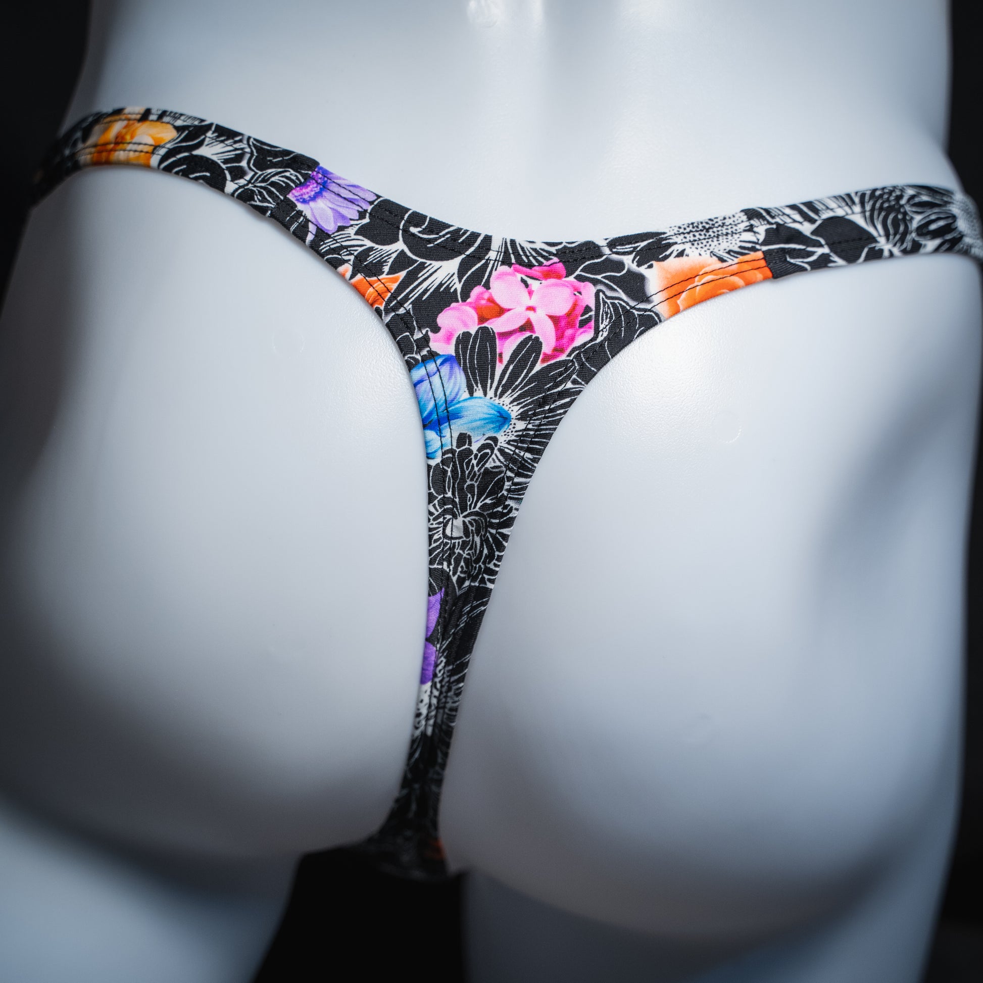 Men's sketch floral thong, slim cut, rear view.