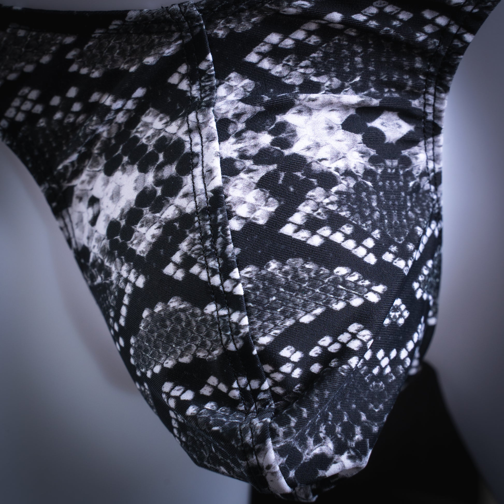 handmade mens thong underwear, black and white snakeskin print, spandex material, slim cut, closeup front view
