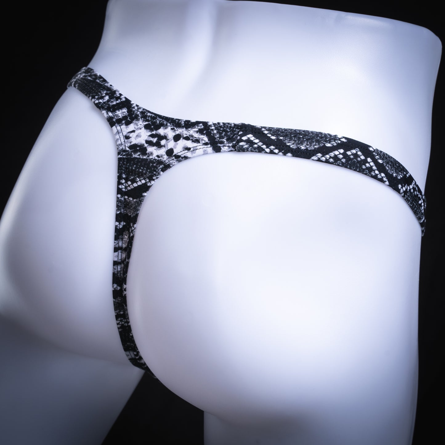 handmade mens thong underwear, black and white snakeskin print, spandex material, slim cut, angled back view