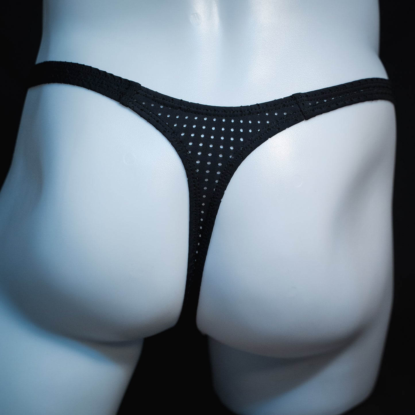 men's black mesh thong underwear, slim cut, rear view.