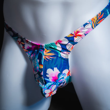Men’s thong underwear, slim cut, blue exotic floral spandex, handmade, angled front view.