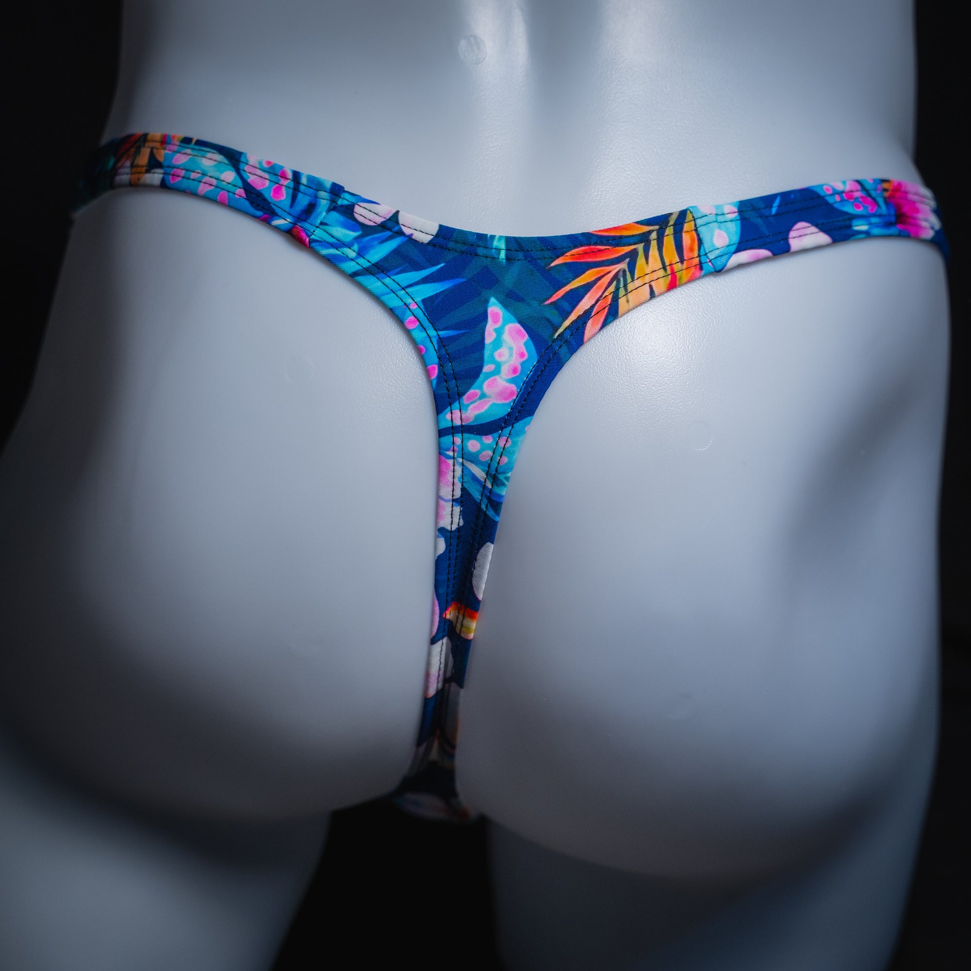Mens' blue floral thong, slim cut, rear view.