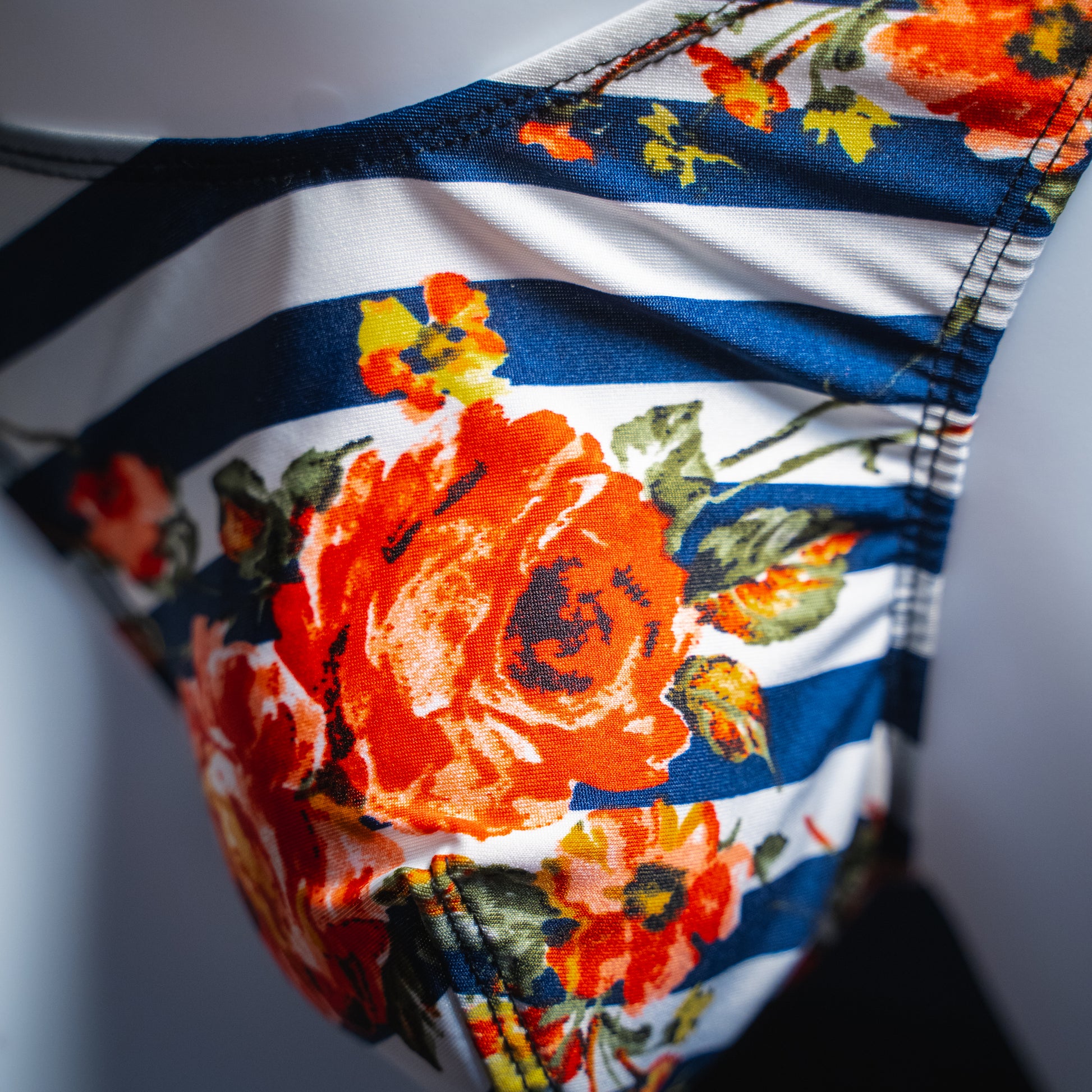handmade mens thong underwear, floral striped pattern, polyester material, classic cut variation, closeup front view