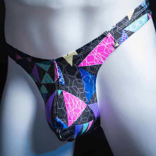handmade mens thong underwear, bright geometric shapes pattern, robust cut design, spandex material, angled front view