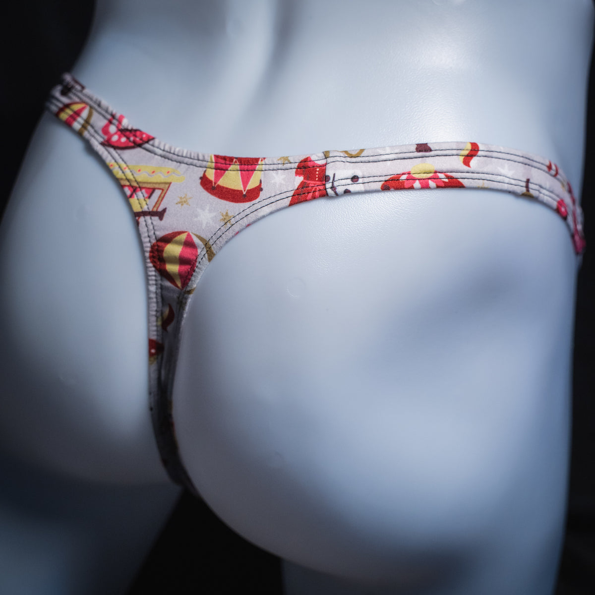 Men's Christmas gifts thong underwear, slim cut, angled rear view.
