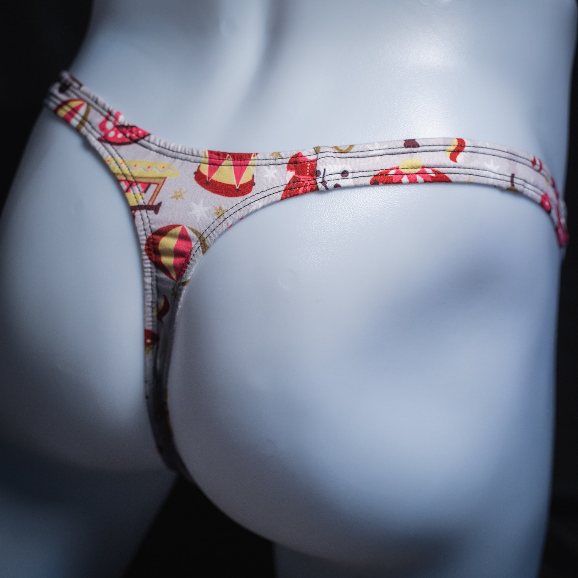 Men's Christmas gifts thong underwear, slim cut, angled rear view.