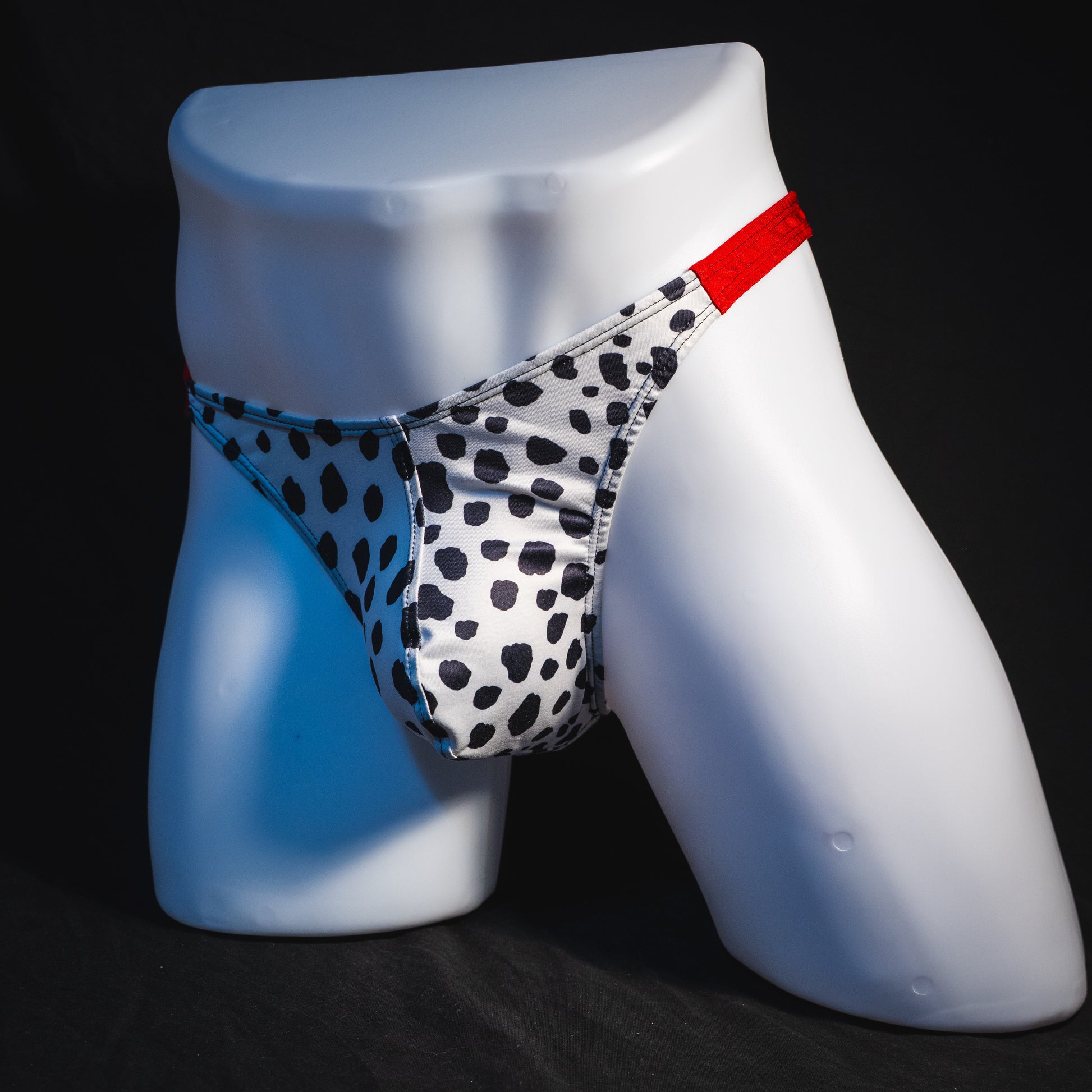 Men's dalmatian thong underwear, classic cut, full angled front view.