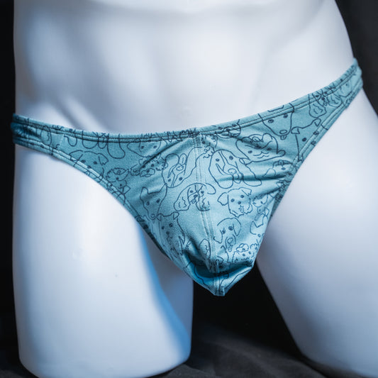 Men's dog faces on blue thong, classic cut, front view.
