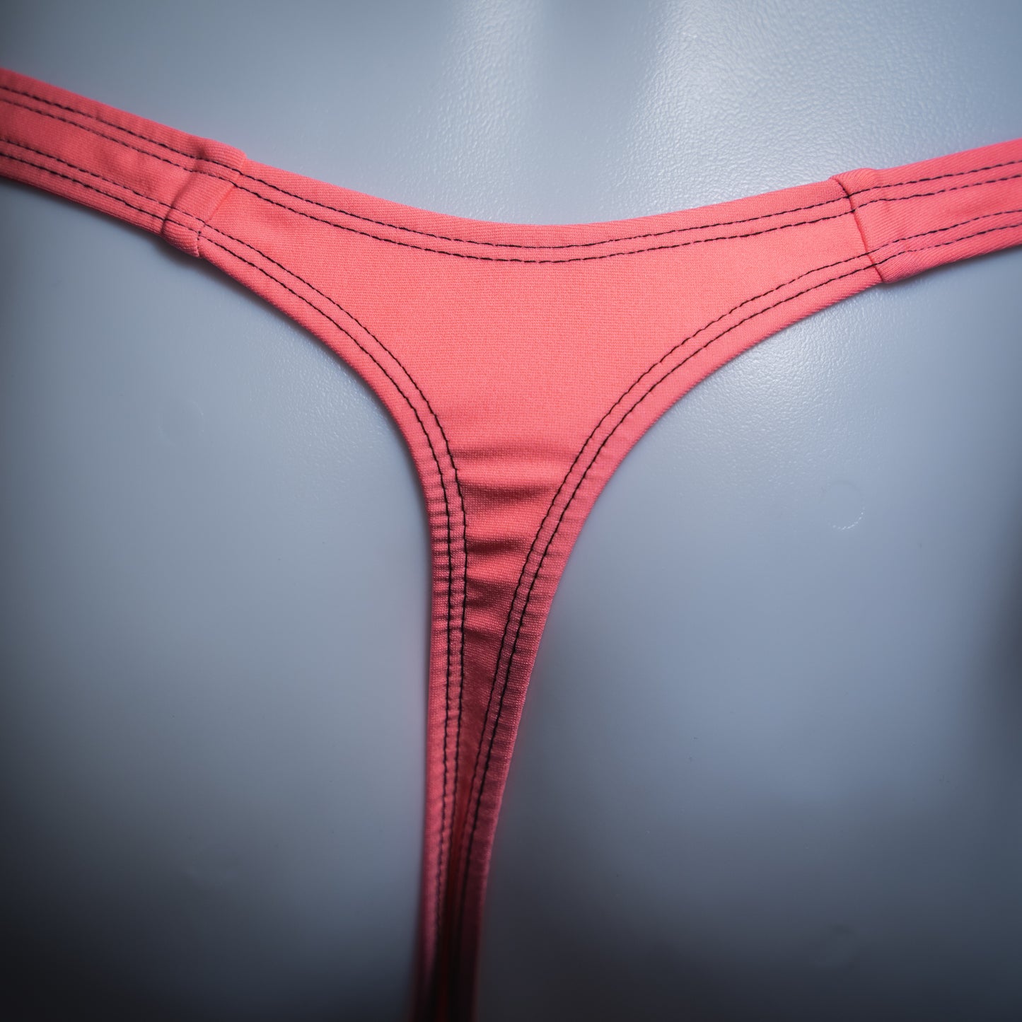 handmade mens thong underwear, flamingo pink print, spandex material, slim cut, close up back view