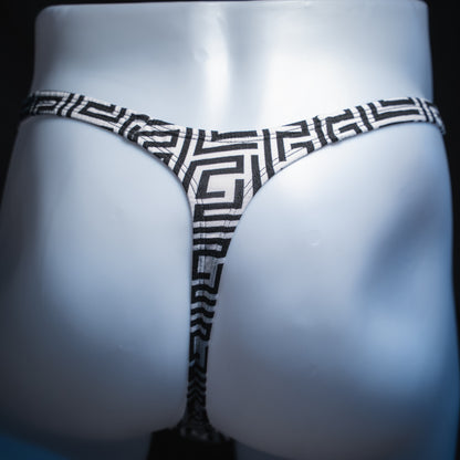 Men’s black-and-white geometric thong underwear, classic cut, back view.
