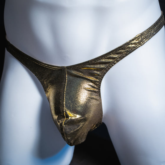 Men's gold metallic thong, slim cut, angled front view.
