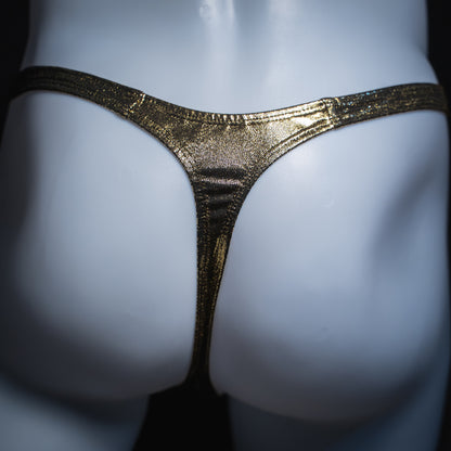 Men's gold metallic thong, slim cut, rear view.