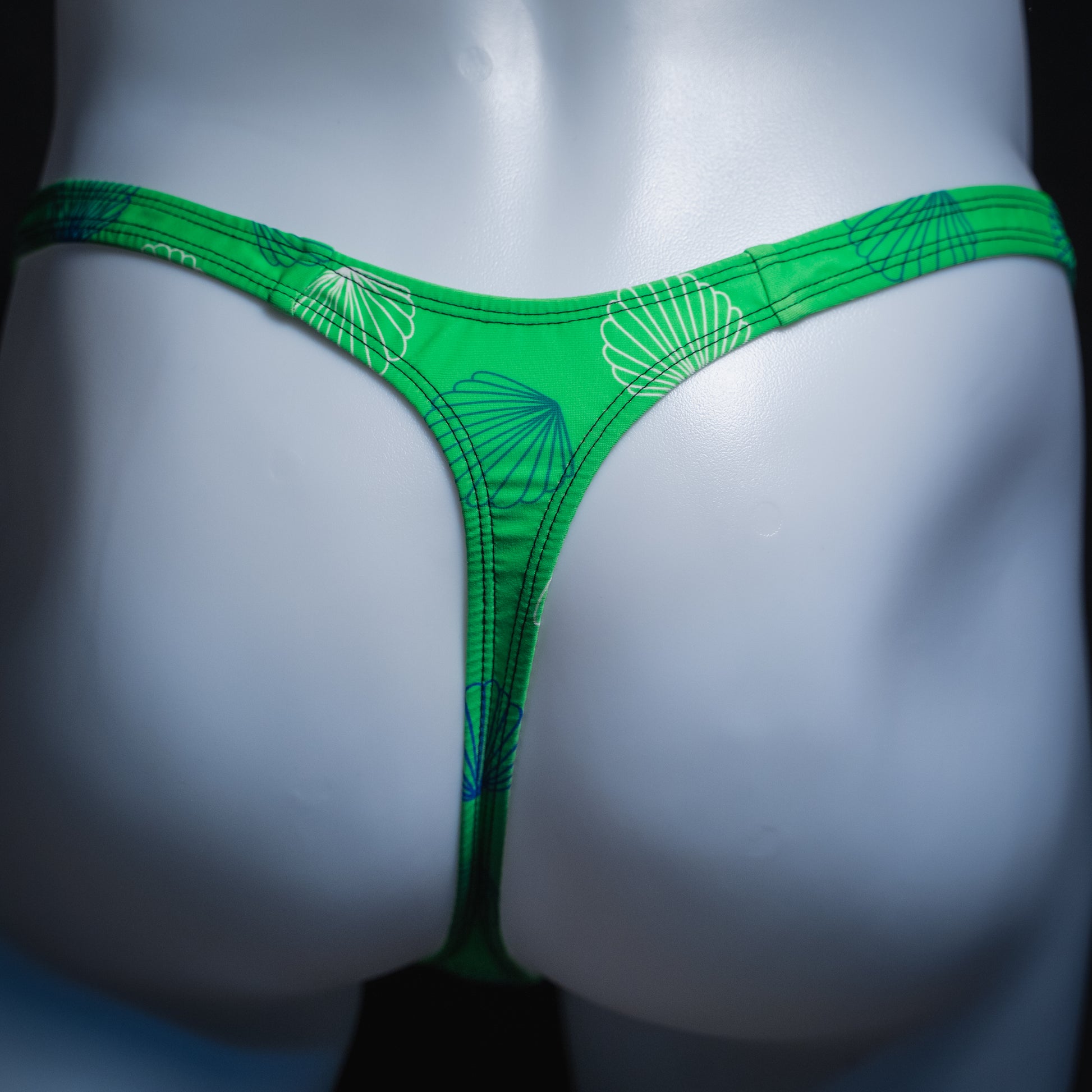 handmade mens thong underwear, green with seashells, spandex, slim cut, back view