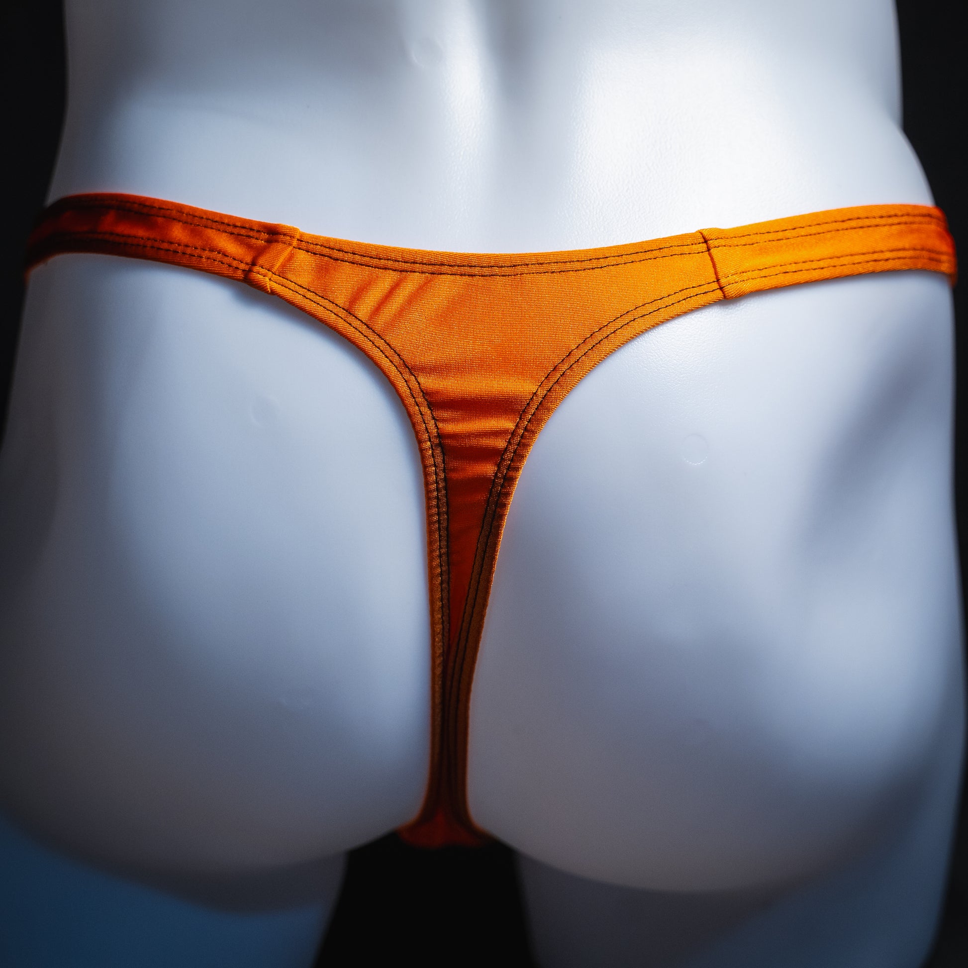 handmade mens thong underwear, solid orange print, spandex material, classic cut variation, back view