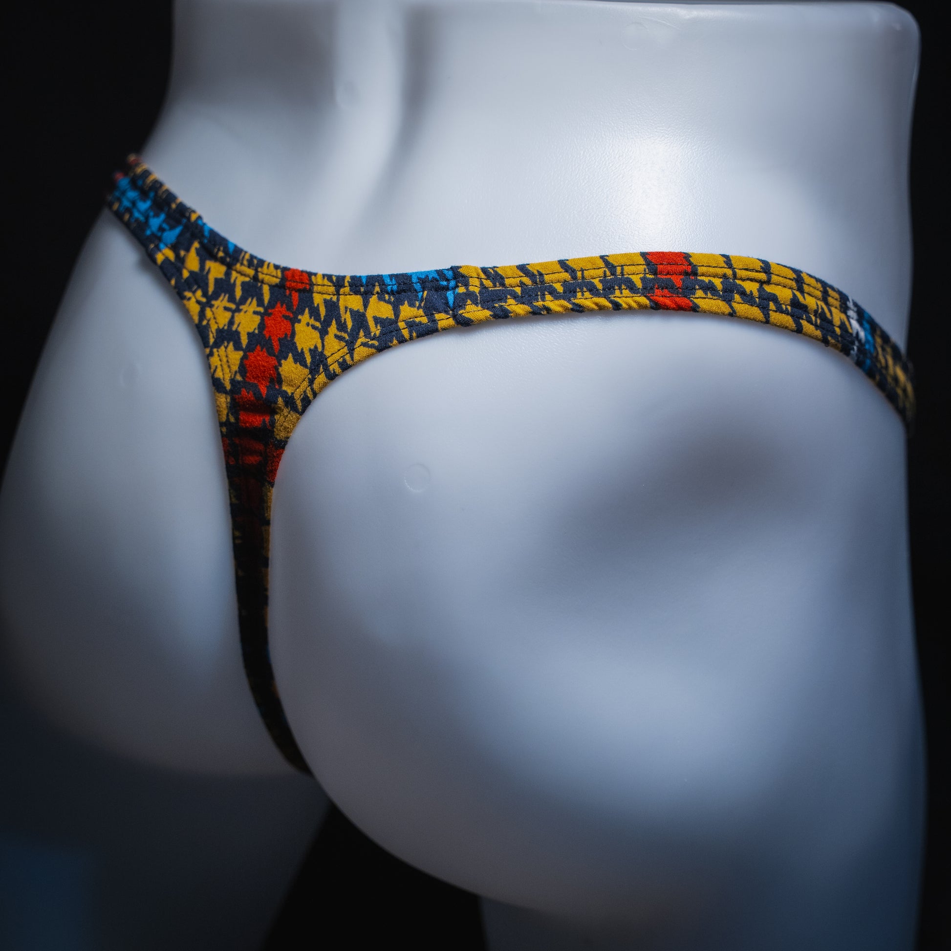 handmade mens thong underwear, jagged shapes print, soft polyester material, classic cut variation, angled back view