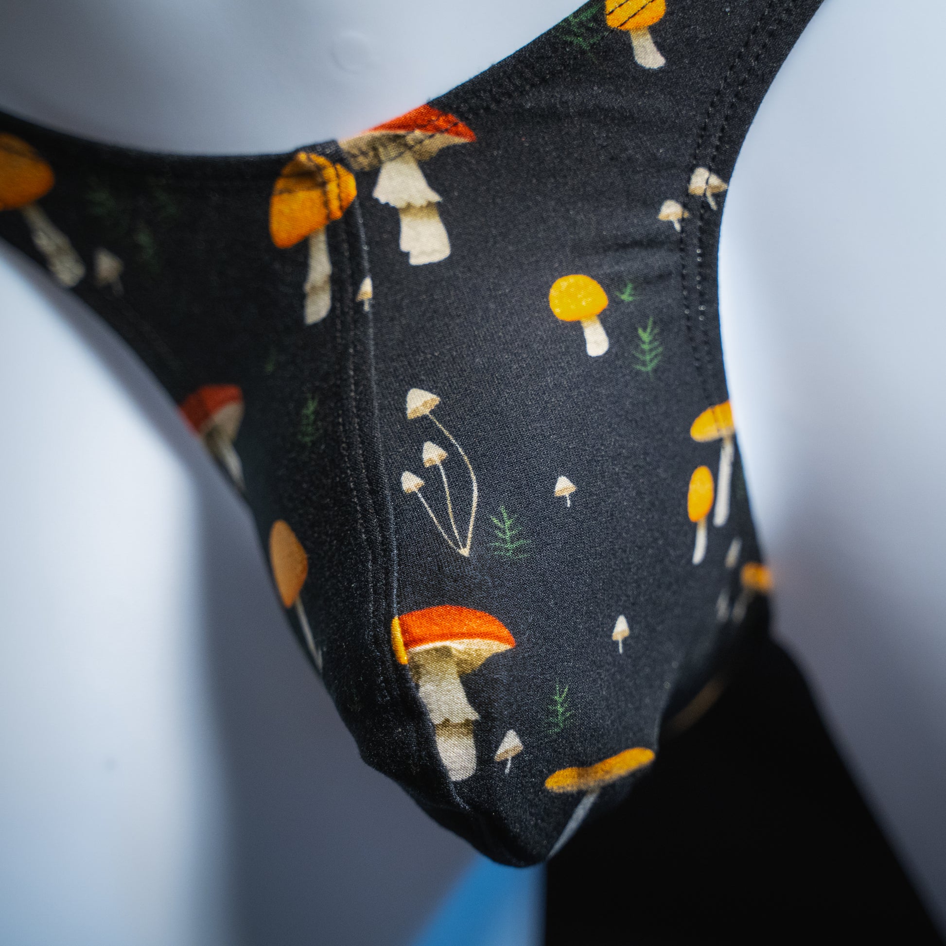 Men's mushroom thong, slim cut, closeup front view.