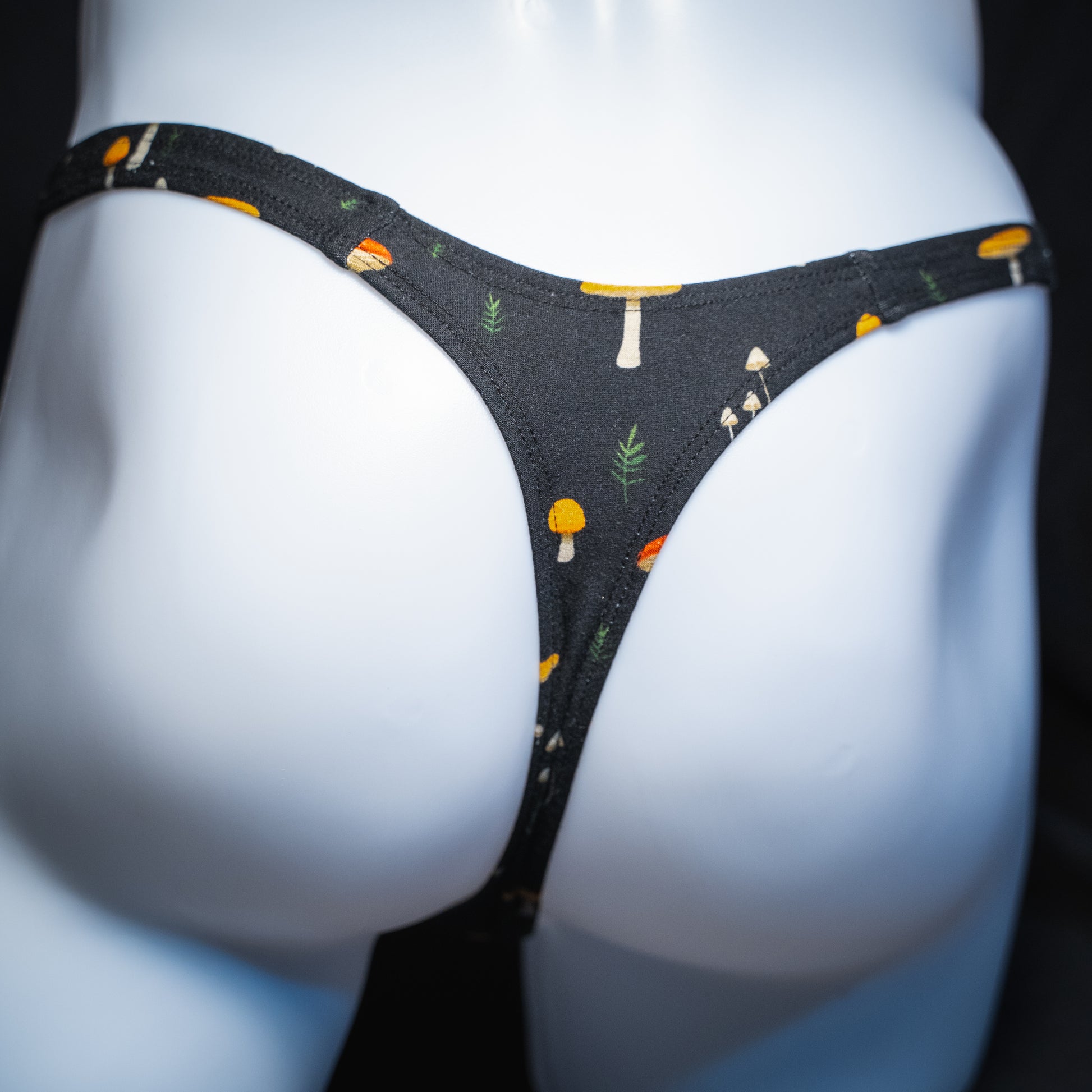 Men's mushroom thong, slim cut, rear view.
