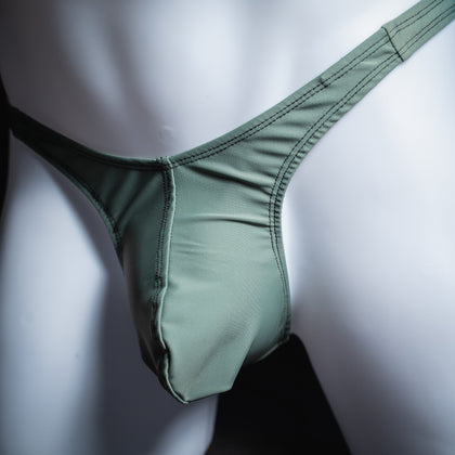 handmade mens thong underwear, muted green print, spandex material, slim cut, angled front view