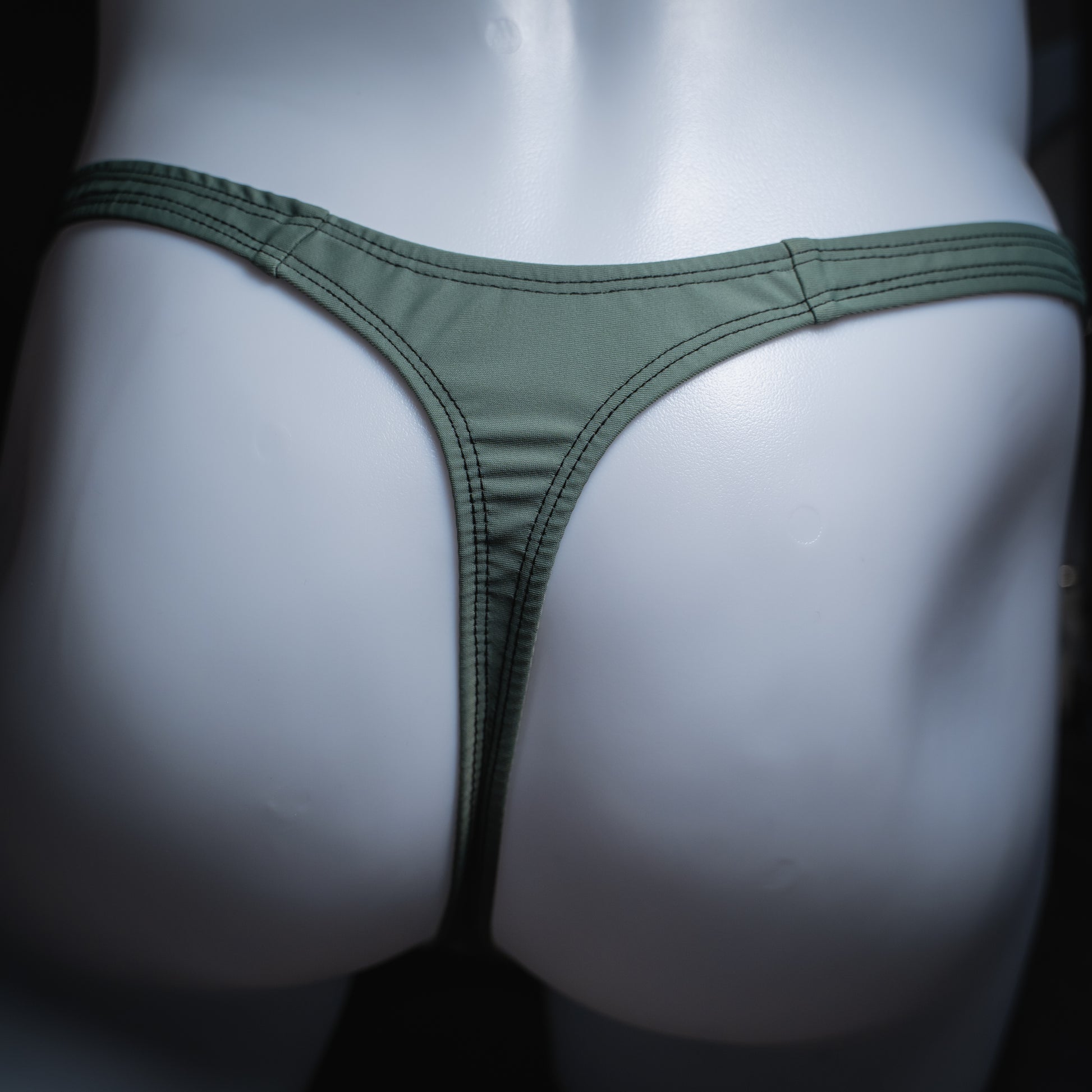 handmade mens thong underwear, muted green print, spandex material, slim cut, back view