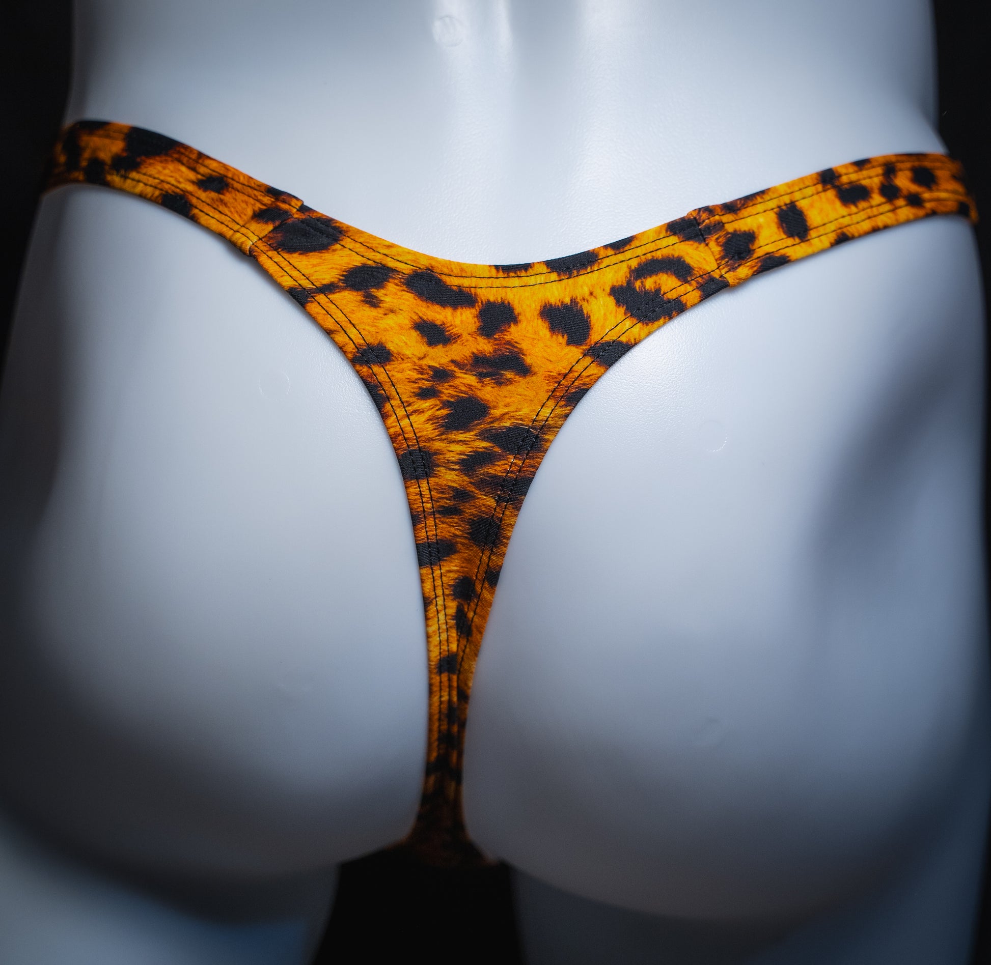 handmade mens thong underwear, orange cheetah print, spandex material, slim cut, back view