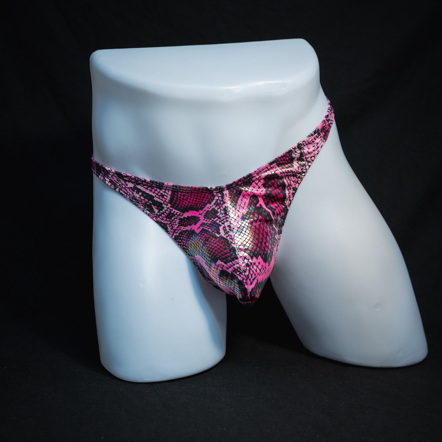 Men's pink metallic snakeskin-print thong underwear, classic cut, full front view.