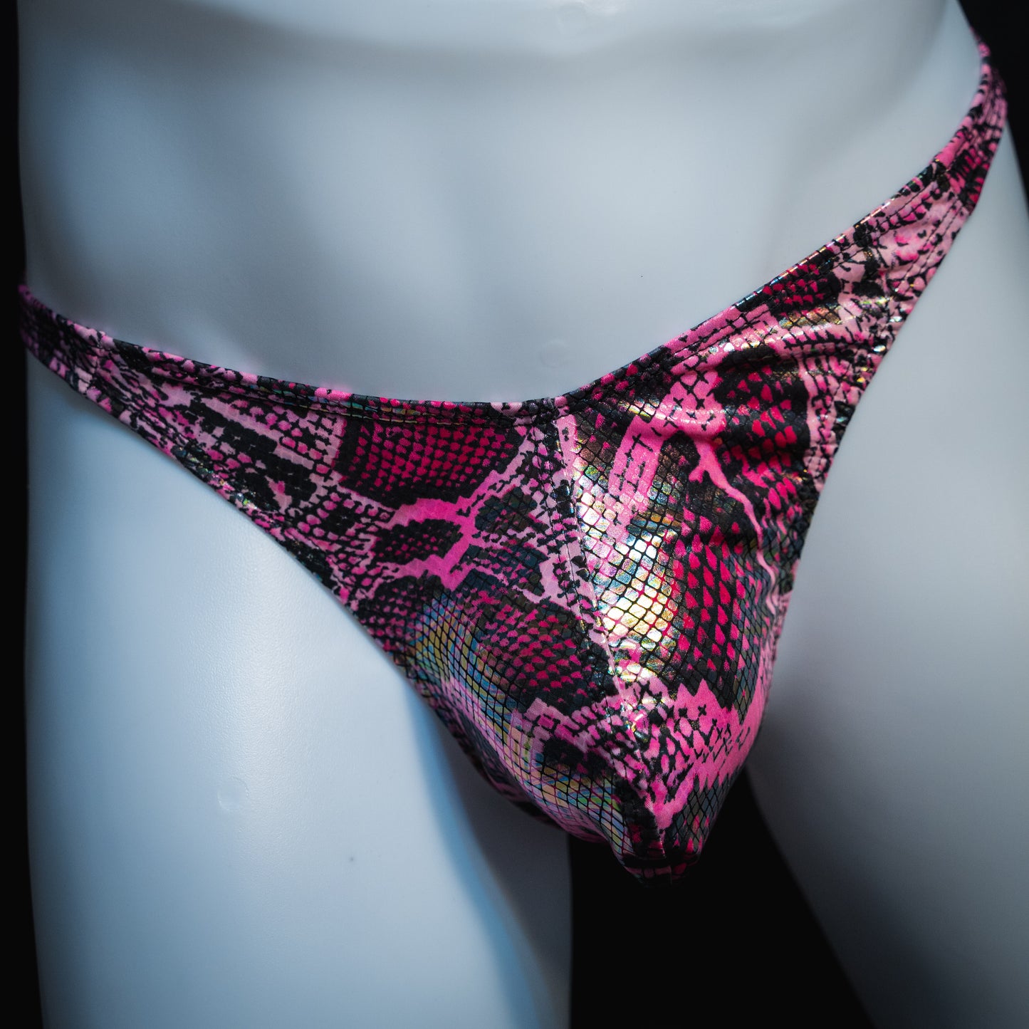 Men's pink metallic snakeskin-print thong underwear, classic cut, front view.