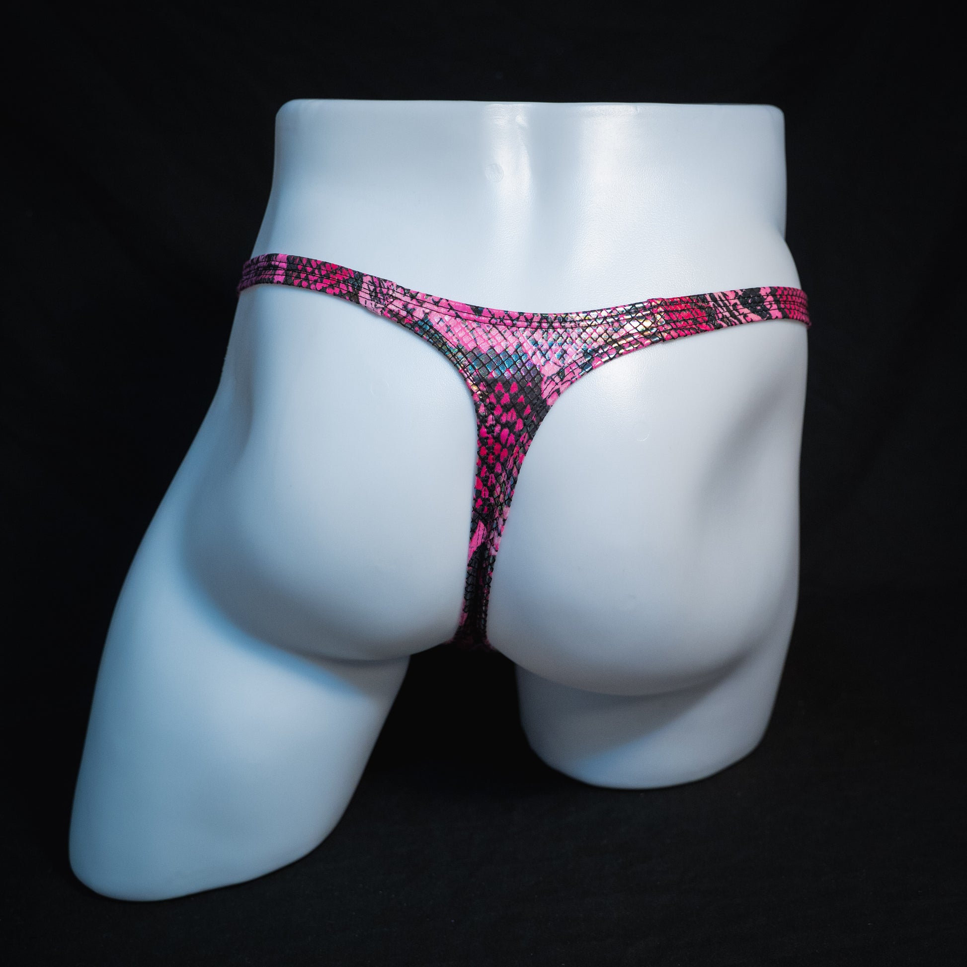 Men's pink metallic snakeskin-print thong underwear, classic cut, full back view.
