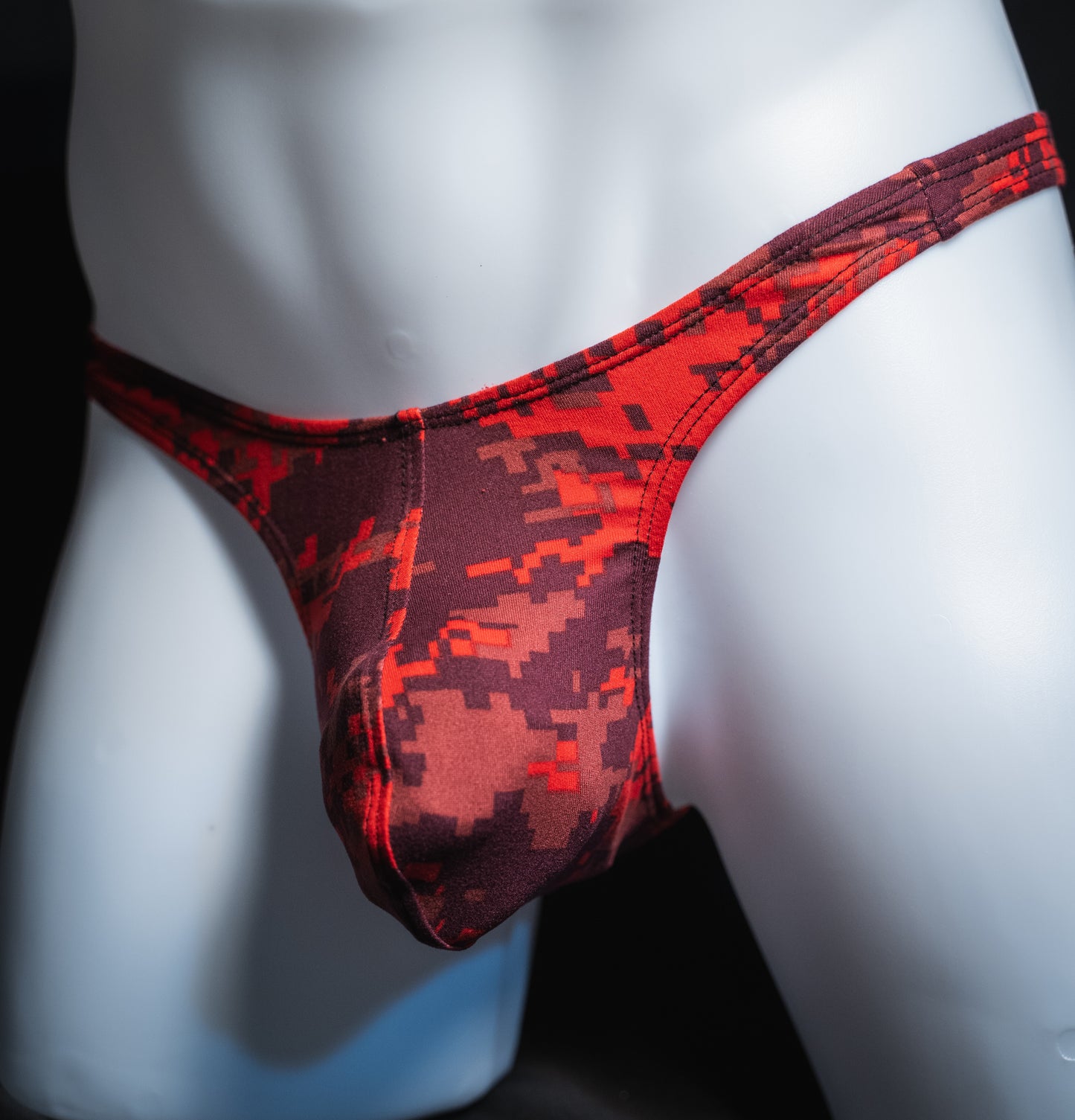 handmade mens thong underwear, red digital camo print, soft polyester material, slim cut variation, angled front view