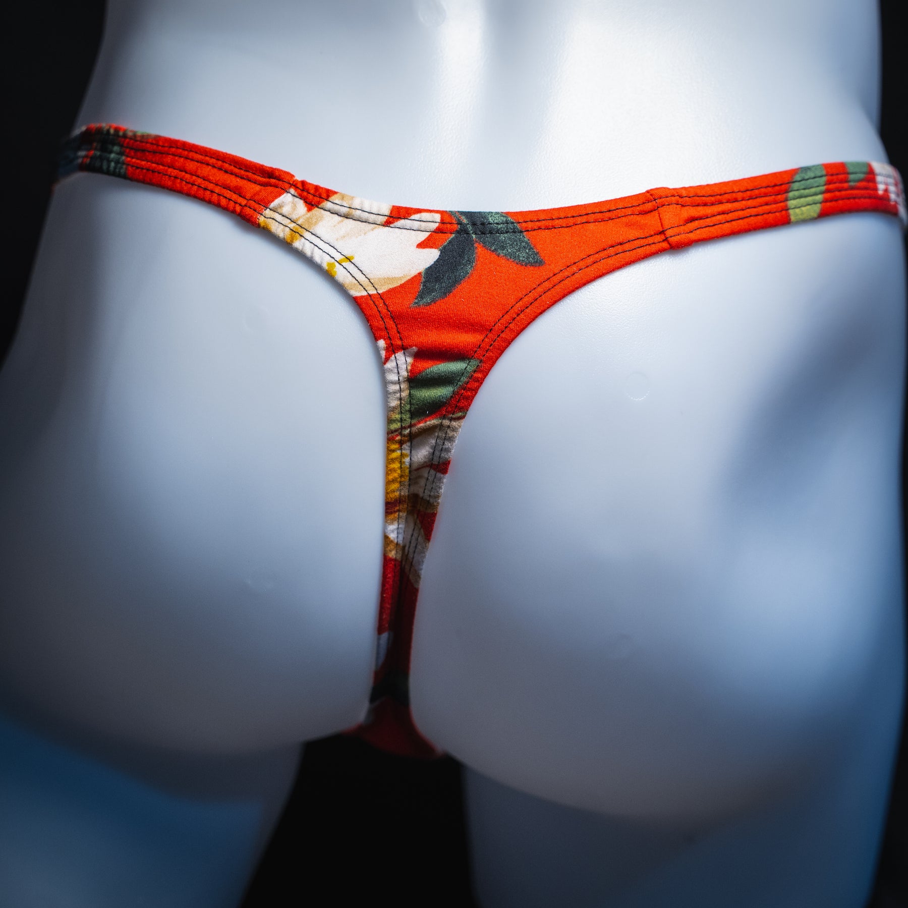 handmade mens thong underwear, red floral print, soft polyester material, slim cut variation, back view