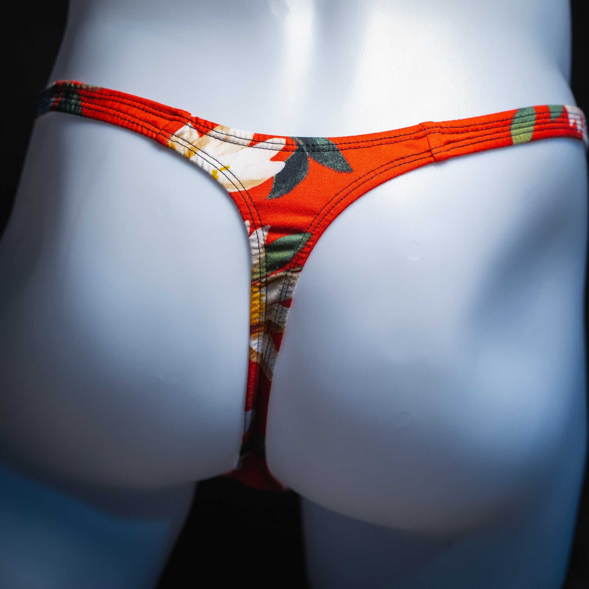 handmade mens thong underwear, red floral print, soft polyester material, slim cut variation, back view