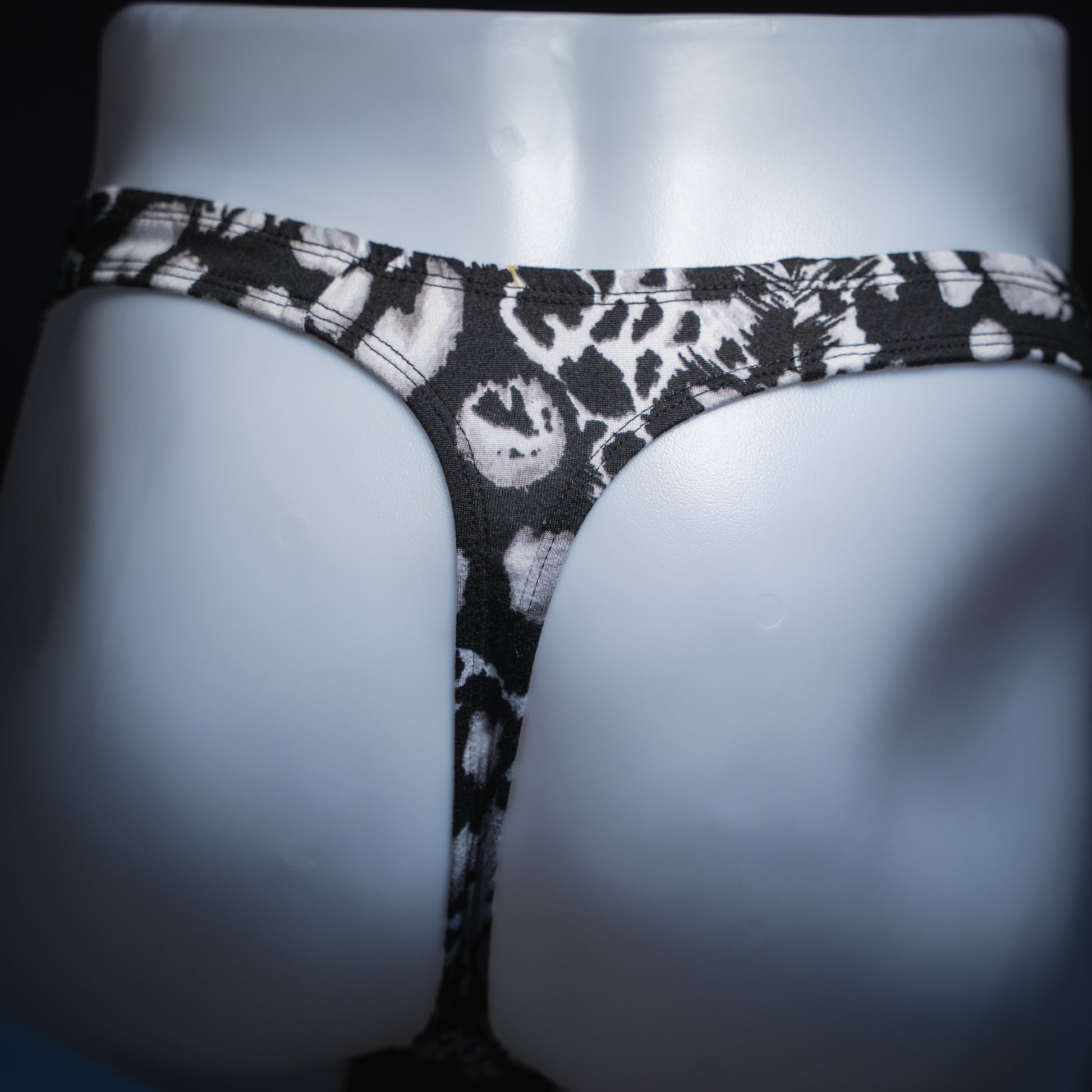 handmade mens thong underwear, white animal print, soft polyester material, robust cut design, back view