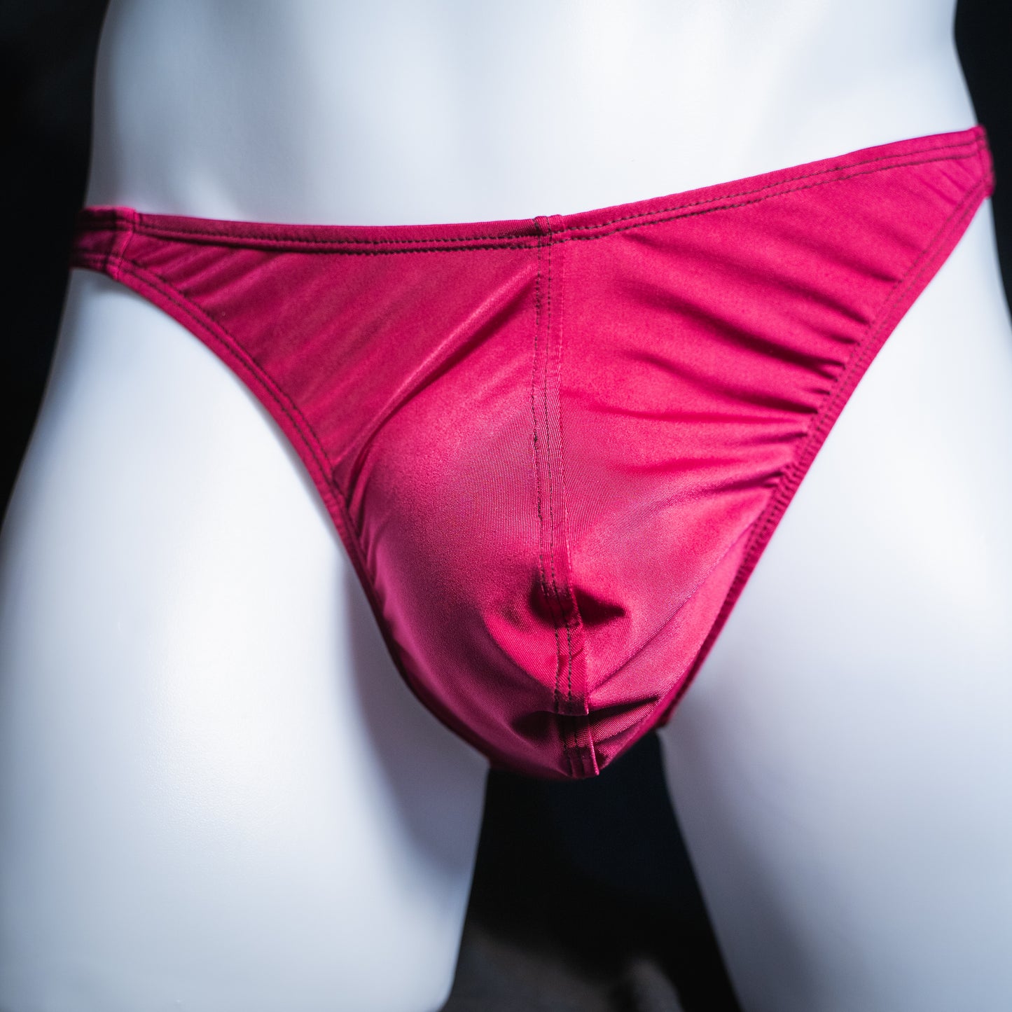 Men's silky maroon thong, classic cut, front view.