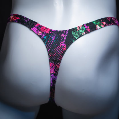 Men's pink and black abstract thong, slim cut, rear view.