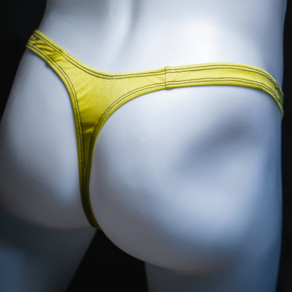 Men's neon yellow thong, slim cut, angled rear view.